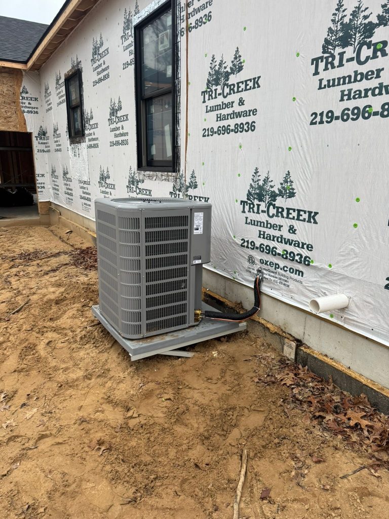 Air conditioner condenser installed at a home under construction