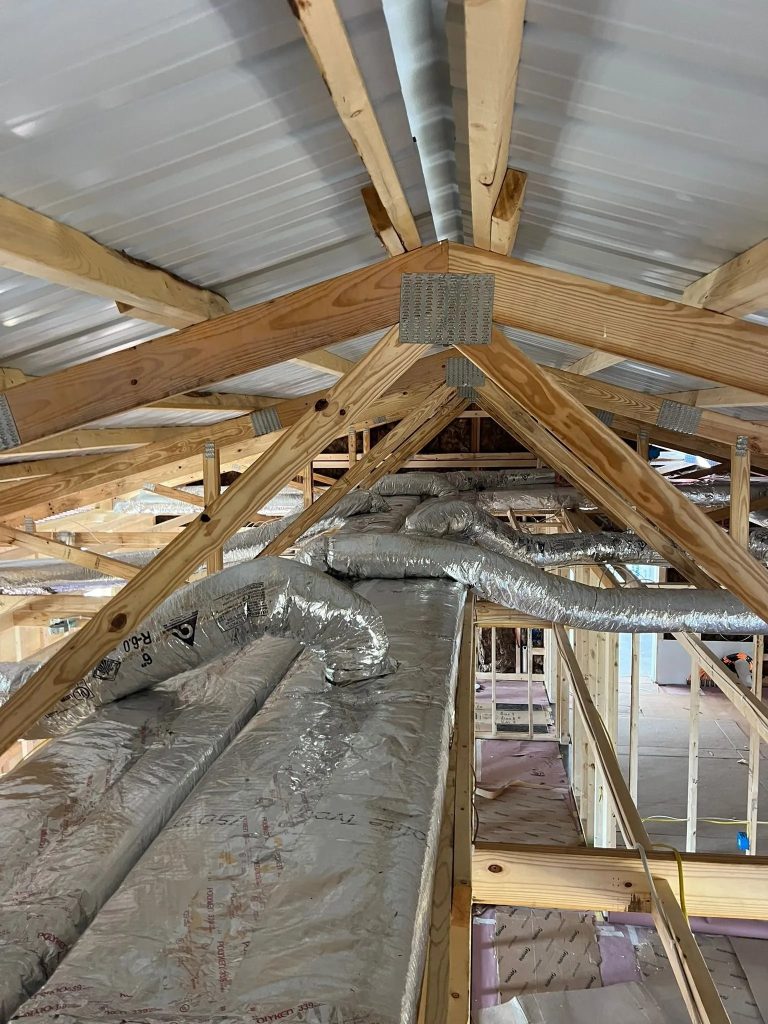 Flexible HVAC ductwork run through an attic by South County Mechanical