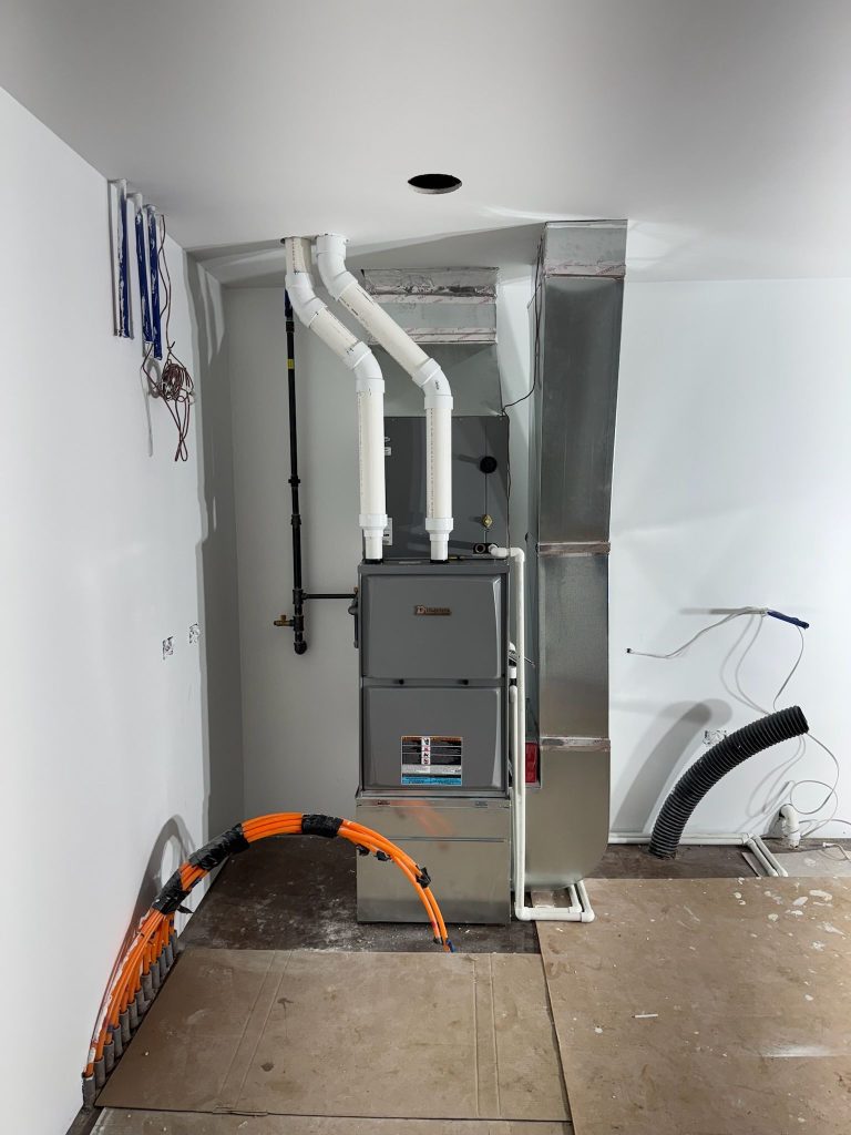 Furnace with PVC venting in a finished utility room