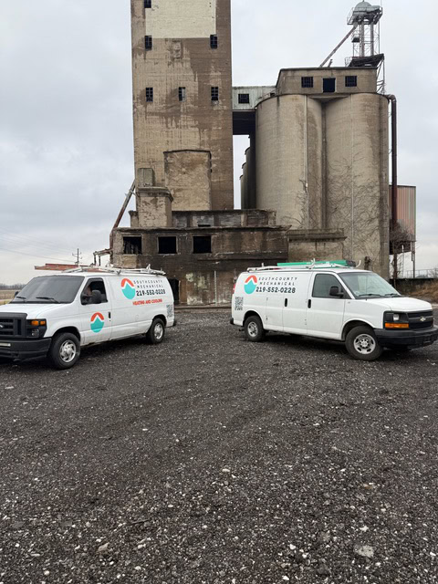 South County Mechanical service vans at an industrial job site